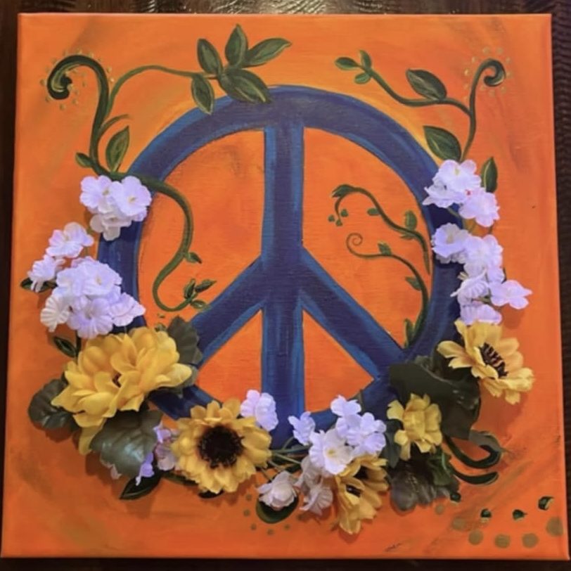 painting of a peace sign with flowers