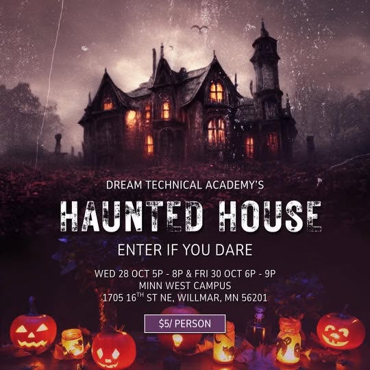 a haunted house in the background with lit jackolanterns i nthe front
