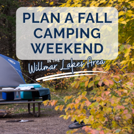 tent by a picnic table amongst fall colored leaves