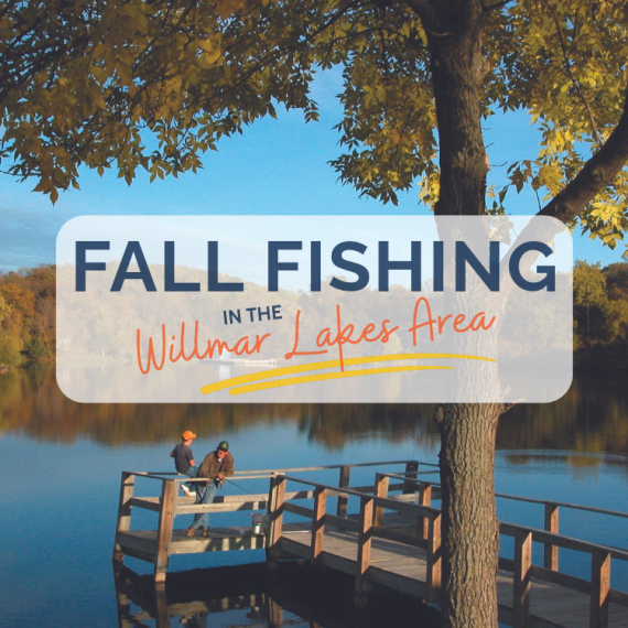 two men fishing on a pier with fall colors around the lake