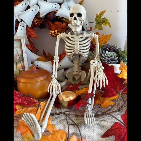 a skeleton sittin in a fall scene with a sound bowl